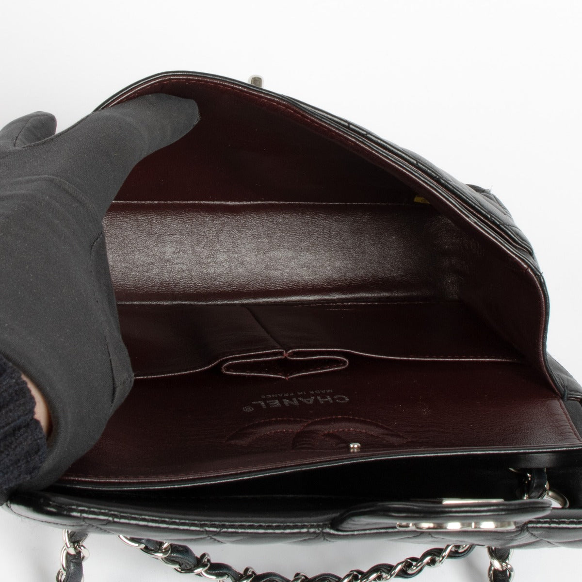 Shop this 100% authentic Chanel Black Lambskin Small Classic Handbag at Labellov.com