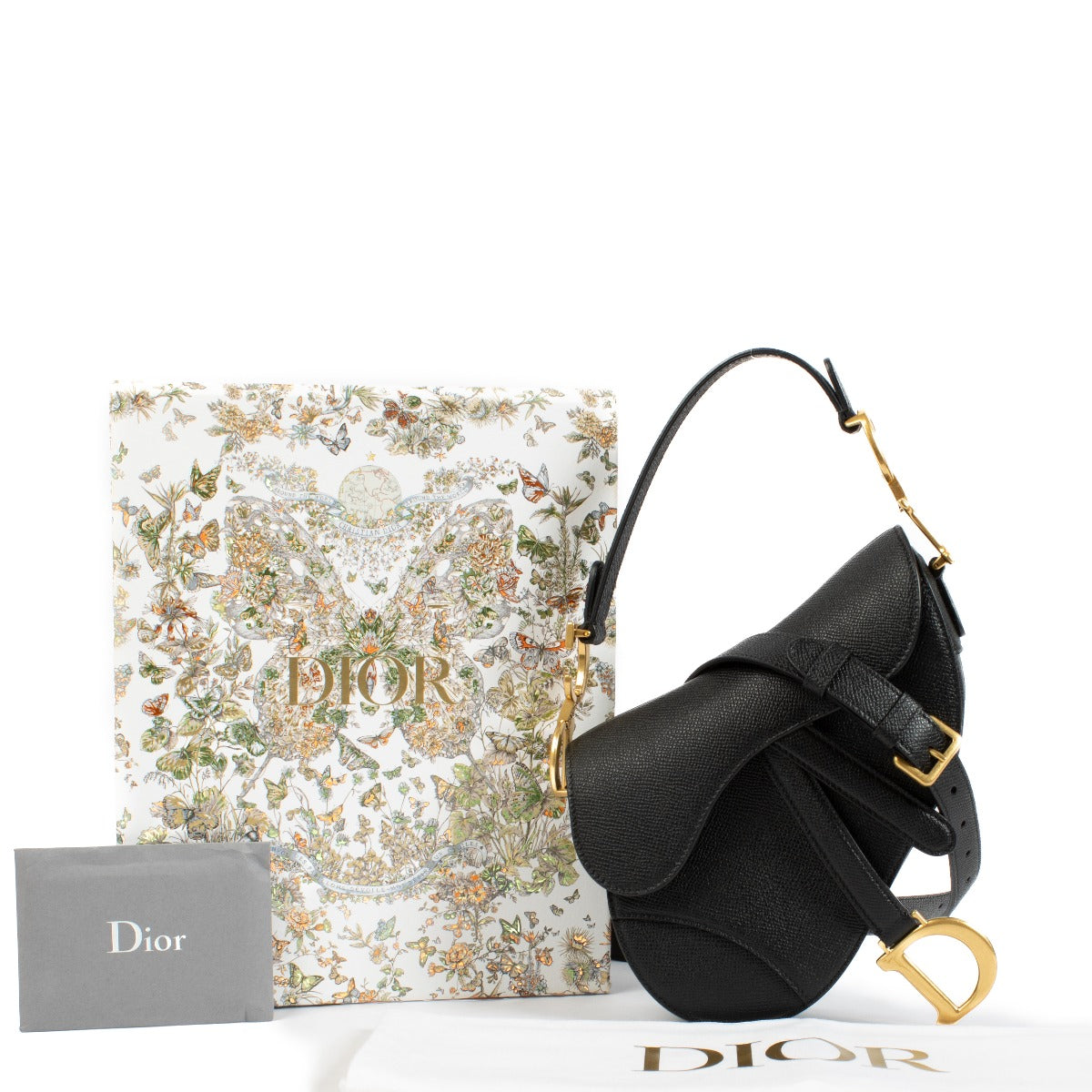 The Dior Black Leather Mini Saddle Bag is a timeless, compact luxury piece in very good condition. Crafted from black leather with gold-tone hardware, it features minimal signs of wear and a versatile strap for effortless styling. Shop now on Labellov.com