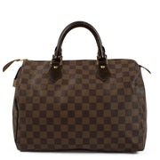 The Louis Vuitton Damier Ebene Speedy 30 is a classic, spacious handbag crafted from signature brown canvas with leather handles and gold-tone hardware. Its timeless design and functional size make it perfect for everyday use or travel. Shop now on Labell