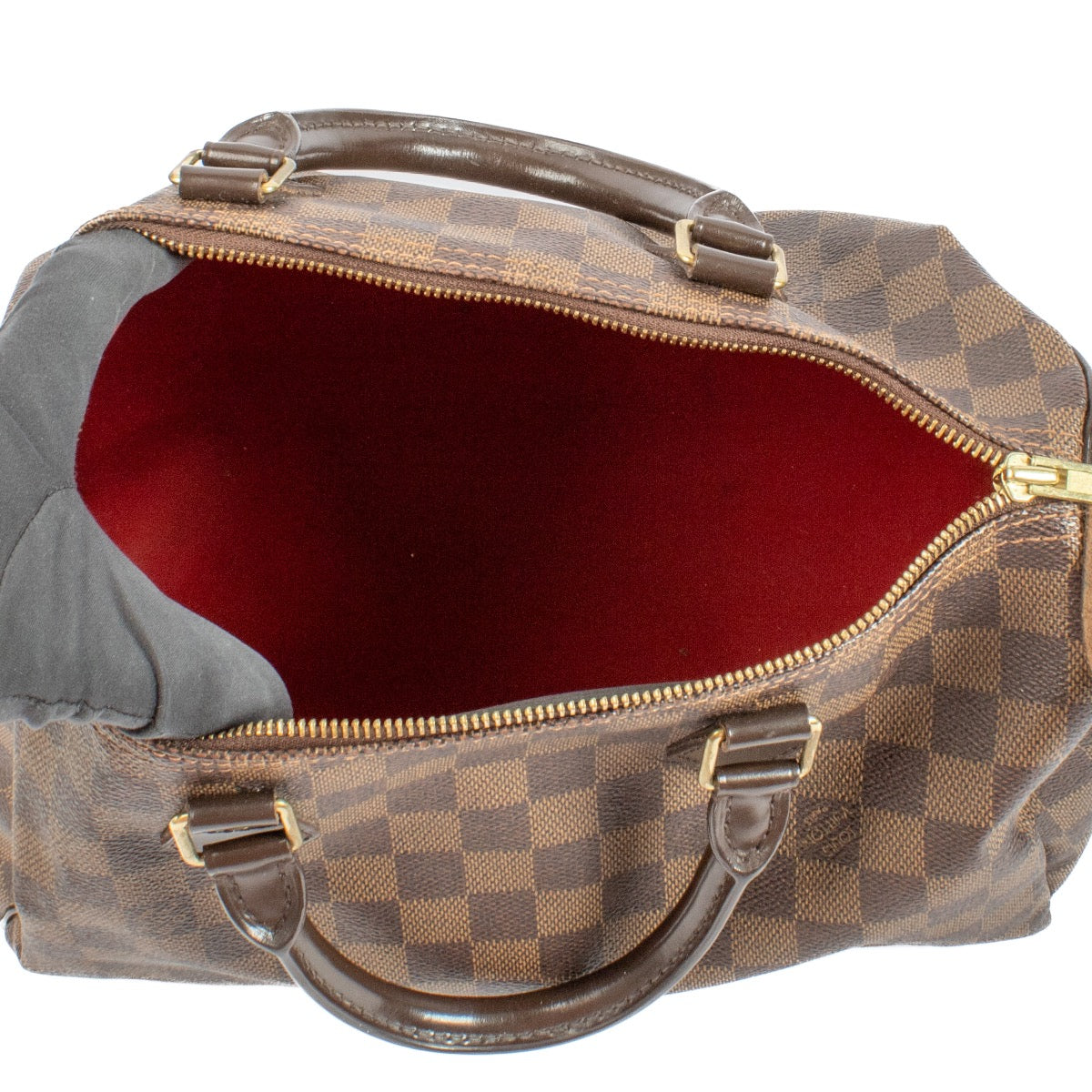 The Louis Vuitton Damier Ebene Speedy 30 is a classic, spacious handbag crafted from signature brown canvas with leather handles and gold-tone hardware. Its timeless design and functional size make it perfect for everyday use or travel. Shop now on Labell