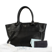 Prada Black City Calf Handbag in luxurious black calf leather, featuring a minimalist design, top handles, adjustable shoulder strap, and spacious interior. Shop now on Labellov.com.