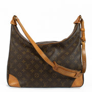 Louis Vuitton Monogram Vintage Boulogne Bag with iconic Monogram canvas, adjustable strap, and natural leather accents, showing minor signs of use for a classic vintage look. Shop now on Labellov.com.