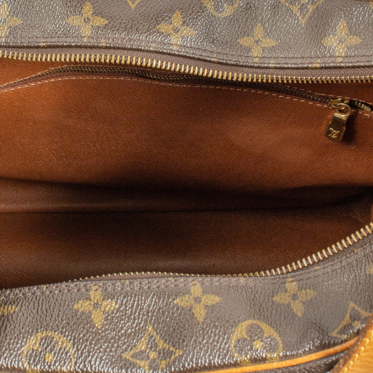 Louis Vuitton Monogram Vintage Boulogne Bag with iconic Monogram canvas, adjustable strap, and natural leather accents, showing minor signs of use for a classic vintage look. Shop now on Labellov.com.