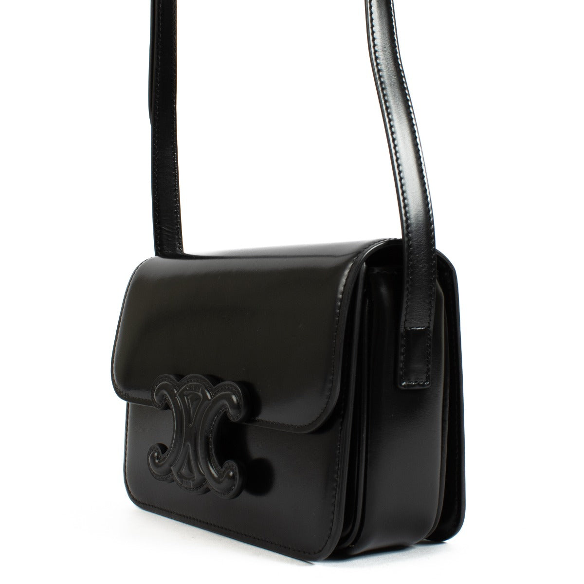 Celine All Black Teen Triomphe Bag in smooth black leather with a matching Triomphe clasp and adjustable strap for a sleek, timeless look. Shop now on Labellov.com.