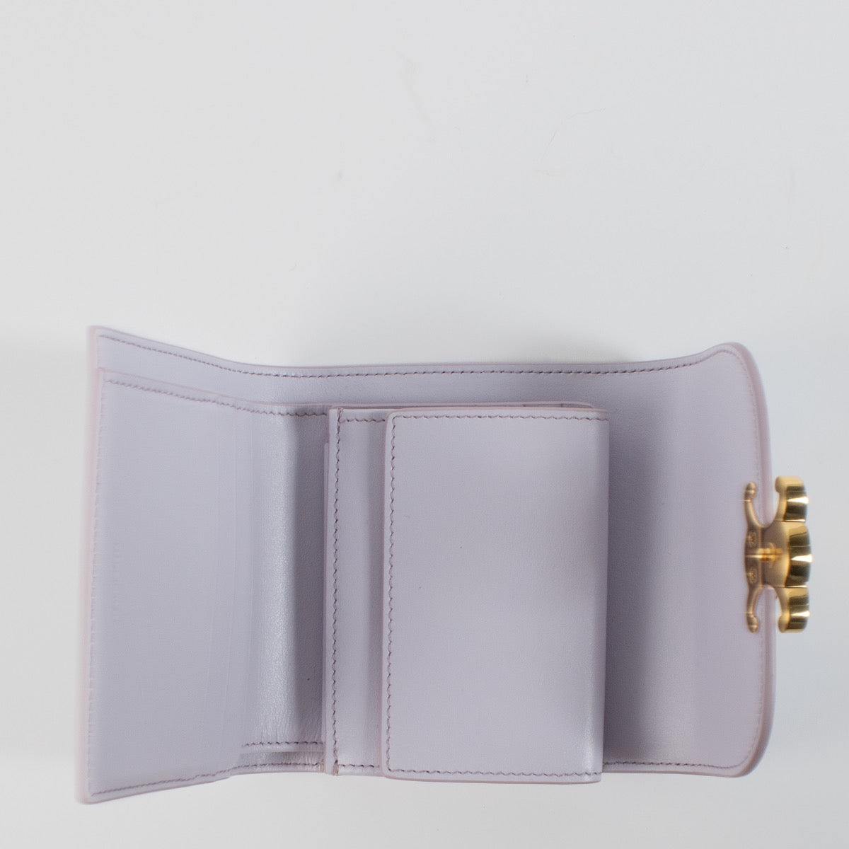 Shop safe online at Labellov in Antwerp, Brussels and Knokke this 100% authentic second hand Celine Pastel Mauve Small Flap Triomphe Wallet.