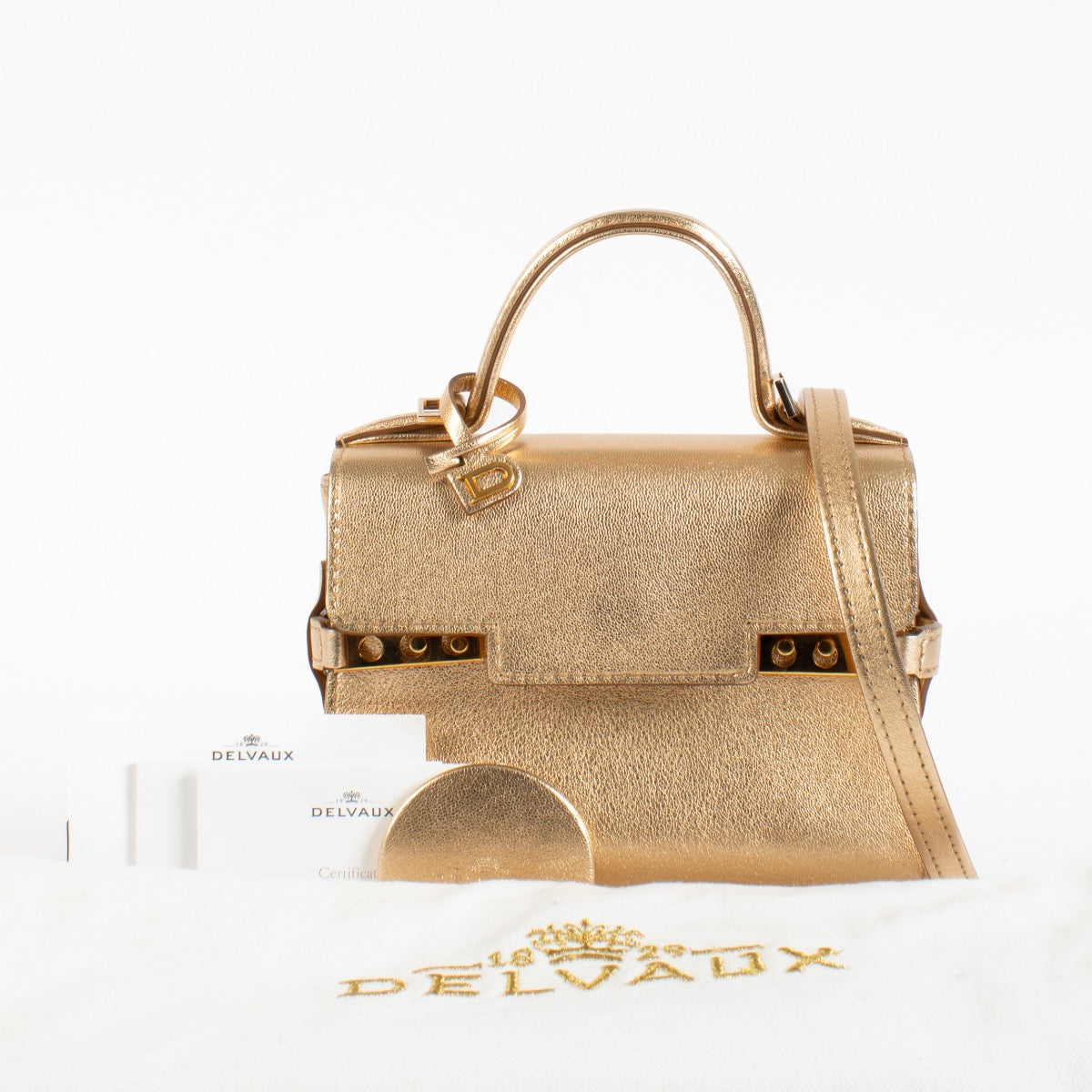 Shop this Delvaux Gold Metallic Mini Brillant Bag in very good condition. Includes dust bag and strap. Discover this iconic piece at Labellov.com