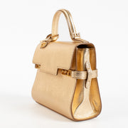 Shop this Delvaux Gold Metallic Mini Brillant Bag in very good condition. Includes dust bag and strap. Discover this iconic piece at Labellov.com
