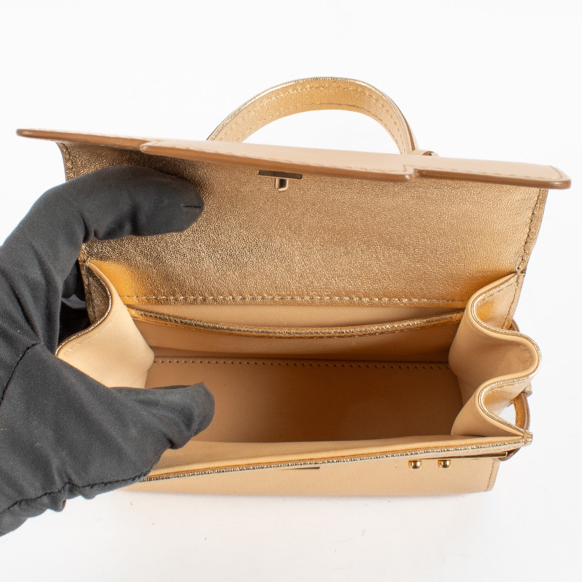 Shop this Delvaux Gold Metallic Mini Brillant Bag in very good condition. Includes dust bag and strap. Discover this iconic piece at Labellov.com