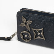 Authentic pre-loved Louis Vuitton Blue Monogram Empreinte With Pins Zippy Wallet on Labellov.com