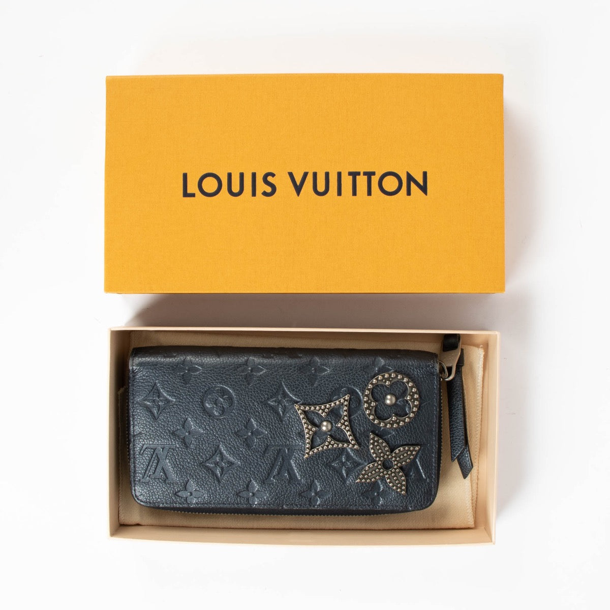 Authentic pre-loved Louis Vuitton Blue Monogram Empreinte With Pins Zippy Wallet on Labellov.com