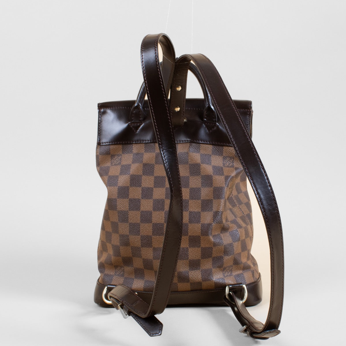 Authentic second hand Louis Vuitton Damier Ebene Soho Backpack on Labellov.com