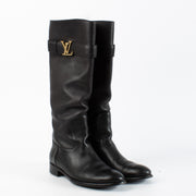 Shop Louis Vuitton black leather knee boots size 39 with gold LV logo buckle. Timeless, elegant design in supple leather available now at Labellov.com.