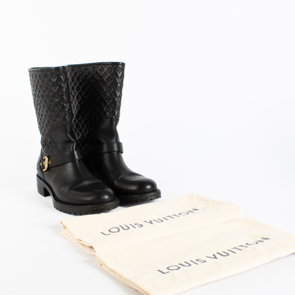 Authentic Pre-Loved Louis Vuitton Black Monogram Embossed Rebellion Ankle Boots - Size 39 1/2 on Labellov.com