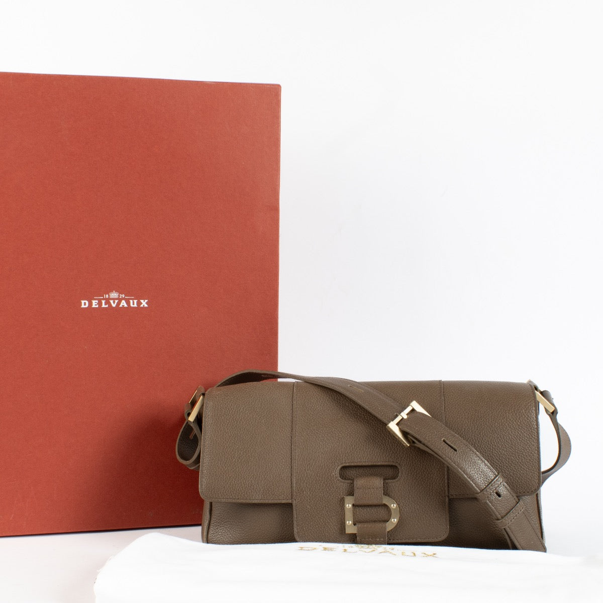 Delvaux Taupe Colette MM shoulder bag in grained leather with signature buckle detail at Labellov.com