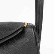 Shop this 100% authentic Hermès Lindy 26 Black Clemence GHW Top Handle Bag at Labellov.com