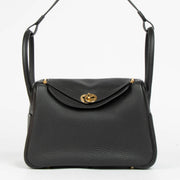 Shop this 100% authentic Hermès Lindy 26 Black Clemence GHW Top Handle Bag at Labellov.com
