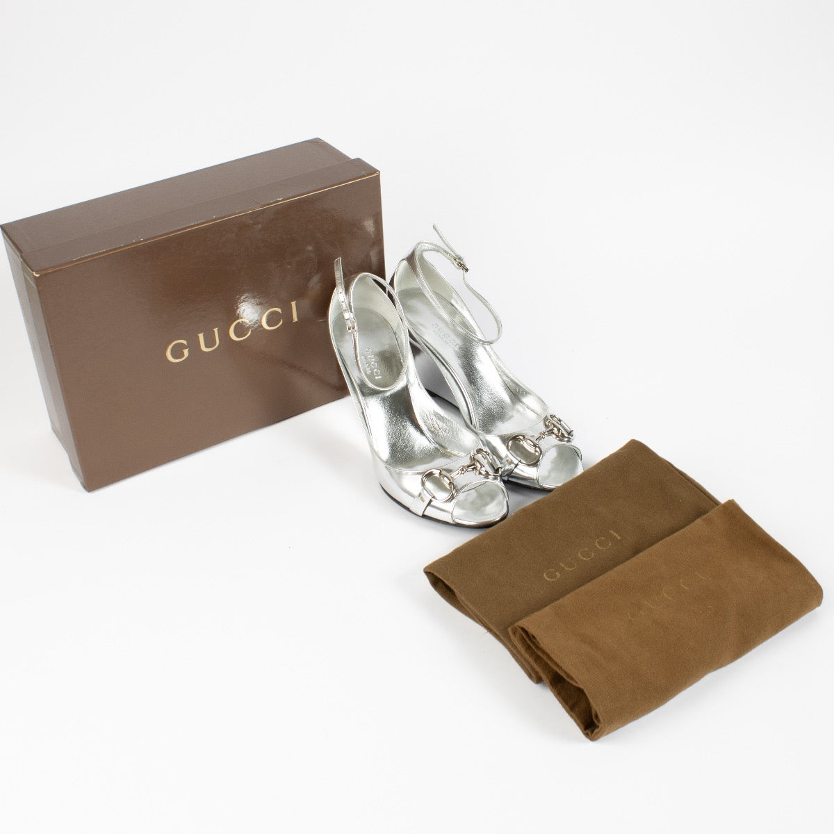 shop 100% authentic second hand Gucci Silver Horsebit Wedge Pumps - Size 38 on Labellov.com