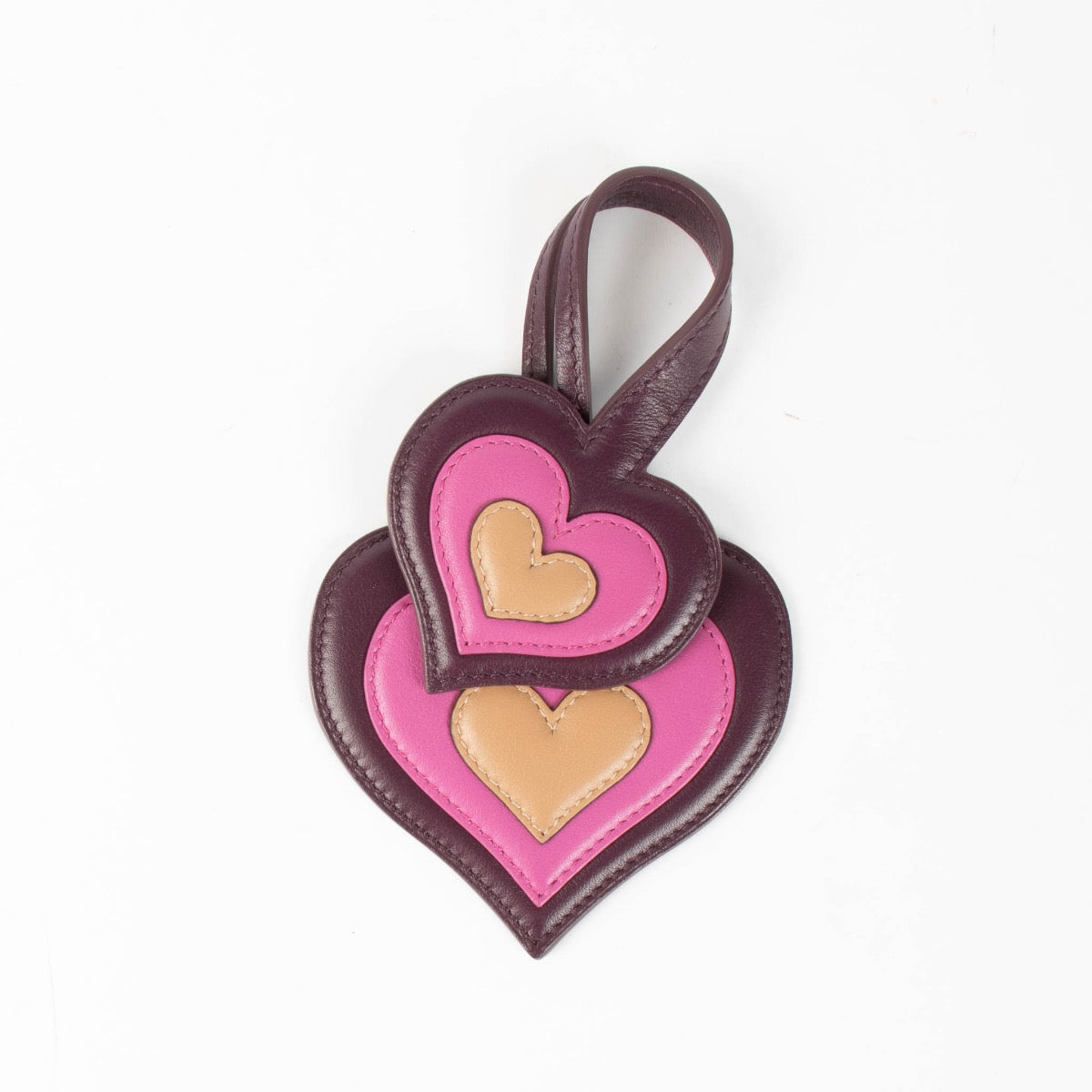 Authentic pre-loved Delvaux Purple Leather Heart Charm on Labellov.com