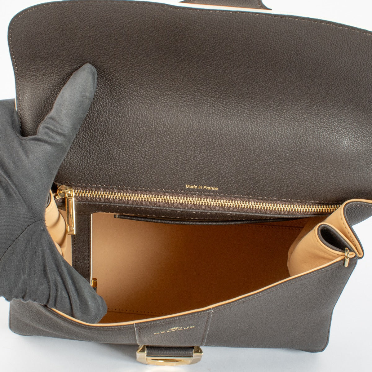 Authentic Delvaux Brillant MM in Ebène Box Calf leather a timeless luxury handbag in excellent condition at Labellov.com.