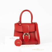 Shop this 100% authentic Delvaux Lipstick Box Calf Brillant Mini Bag at Labellov.com.