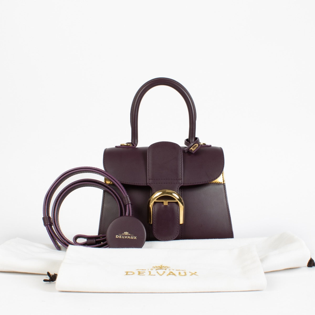 Authentic preloved Delvaux Prune/Antique Gold Box Calf Brillant Mini Mirage on Labellov.com