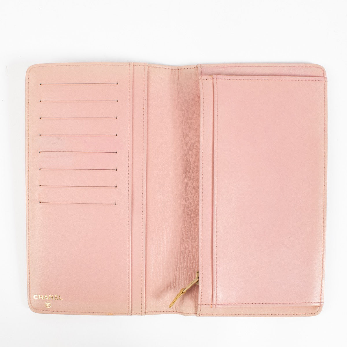 Shop safe online at Labellov in Antwerp, Brussels and Knokke this 100% authentic second hand Chanel Pink Precious Symbols Long Wallet