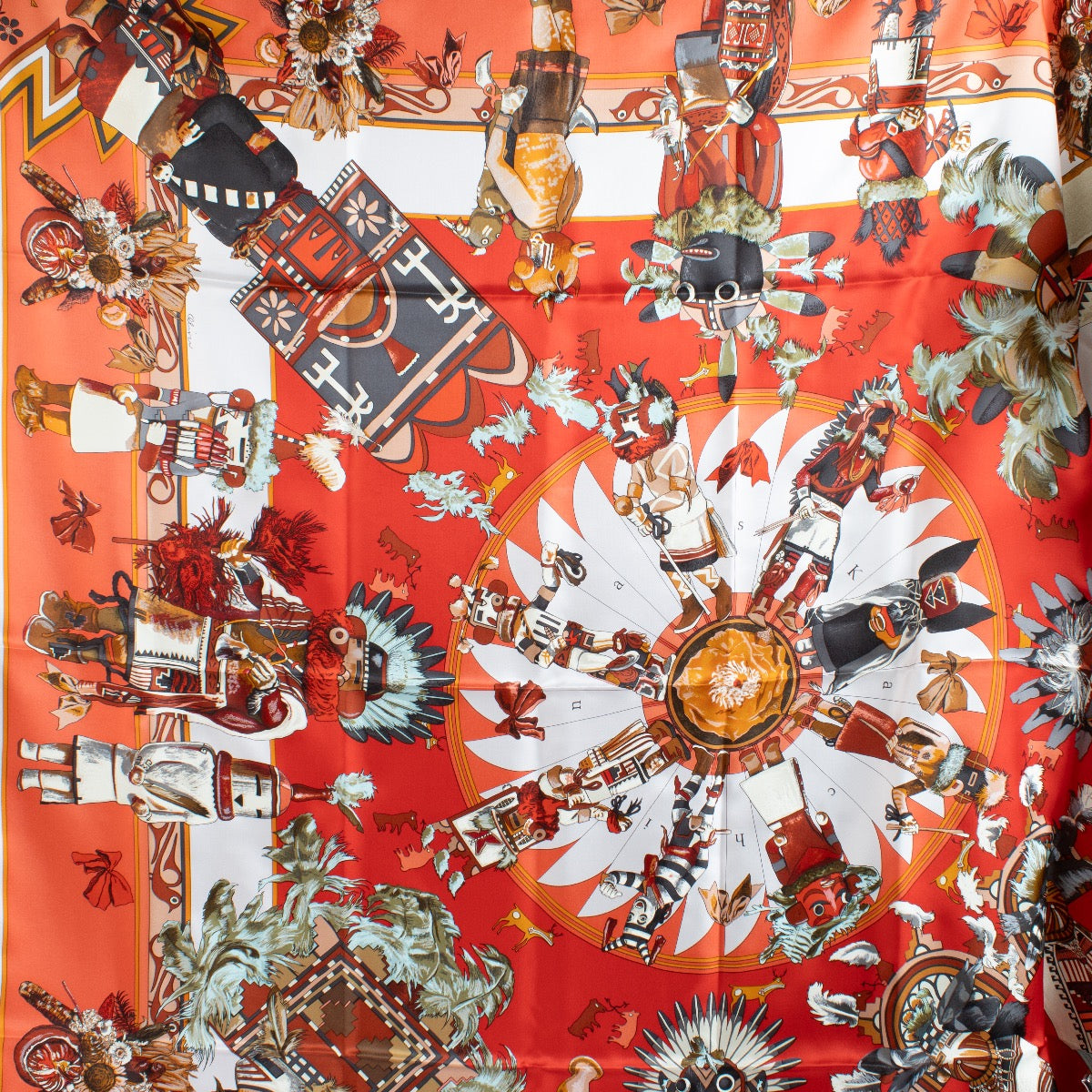 Shop safe online at Labellov in Antwerp, Brussels and Knokke this 100% authentic second hand Hermès Red Kachinas 140 Silk Shawl