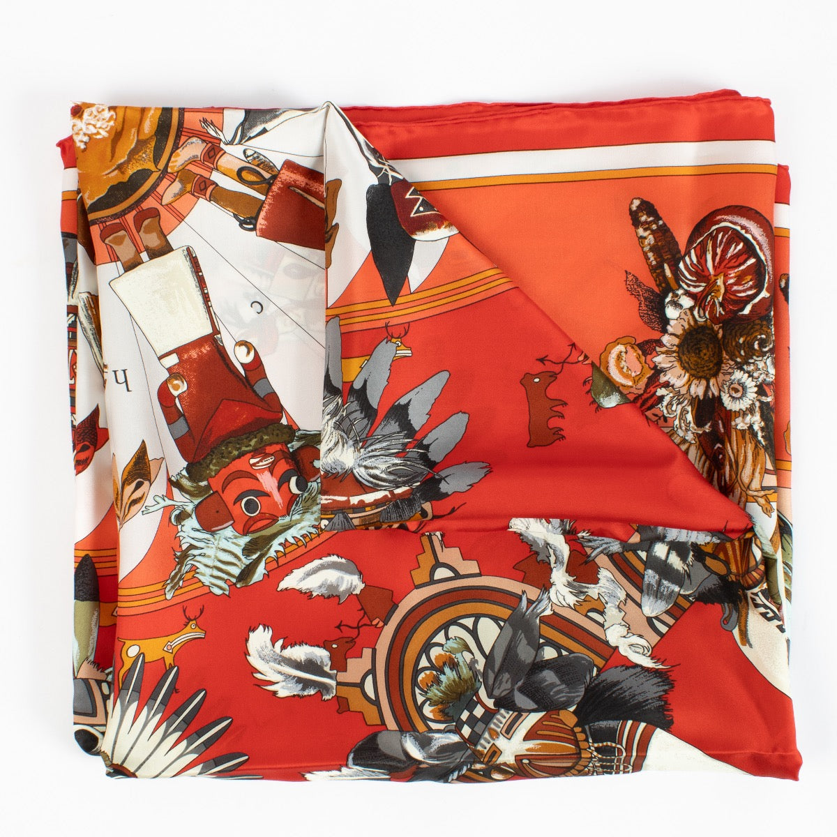 Shop safe online at Labellov in Antwerp, Brussels and Knokke this 100% authentic second hand Hermès Red Kachinas 140 Silk Shawl