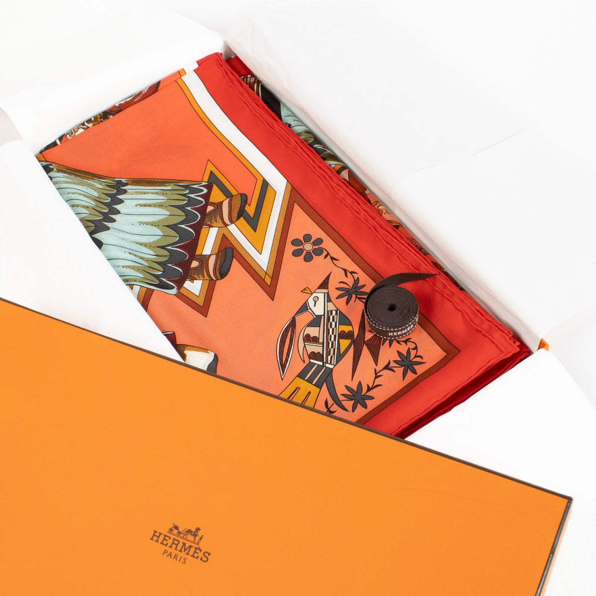 Shop safe online at Labellov in Antwerp, Brussels and Knokke this 100% authentic second hand Hermès Red Kachinas 140 Silk Shawl