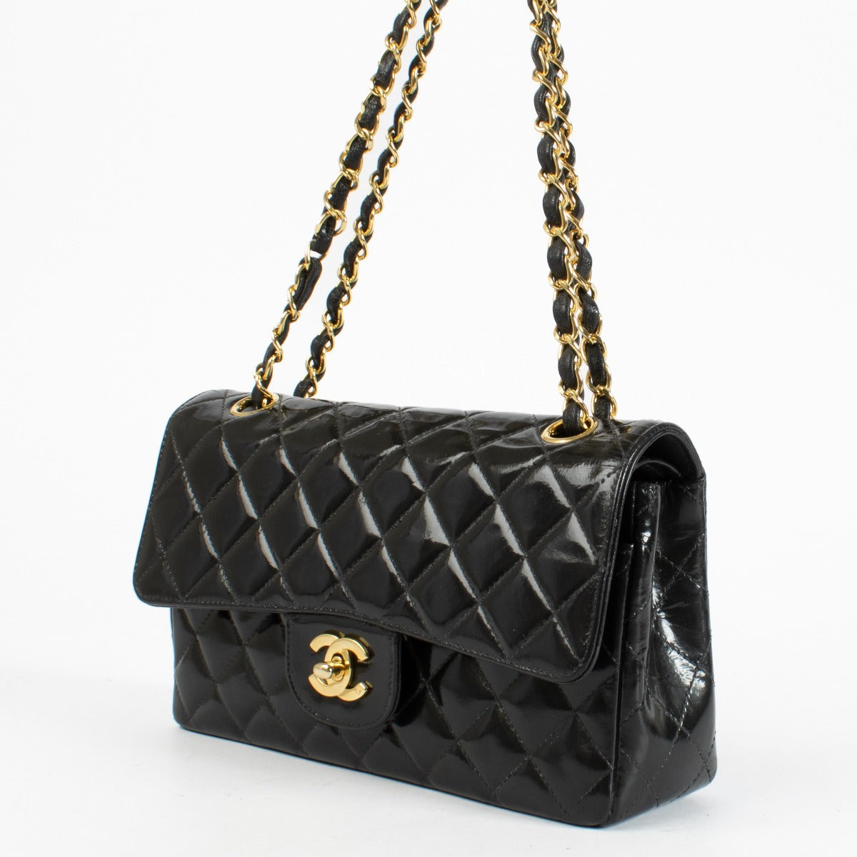 Shop the Chanel Classic Double Flap Bag in black patent leather with gold hardware at Labellov.com