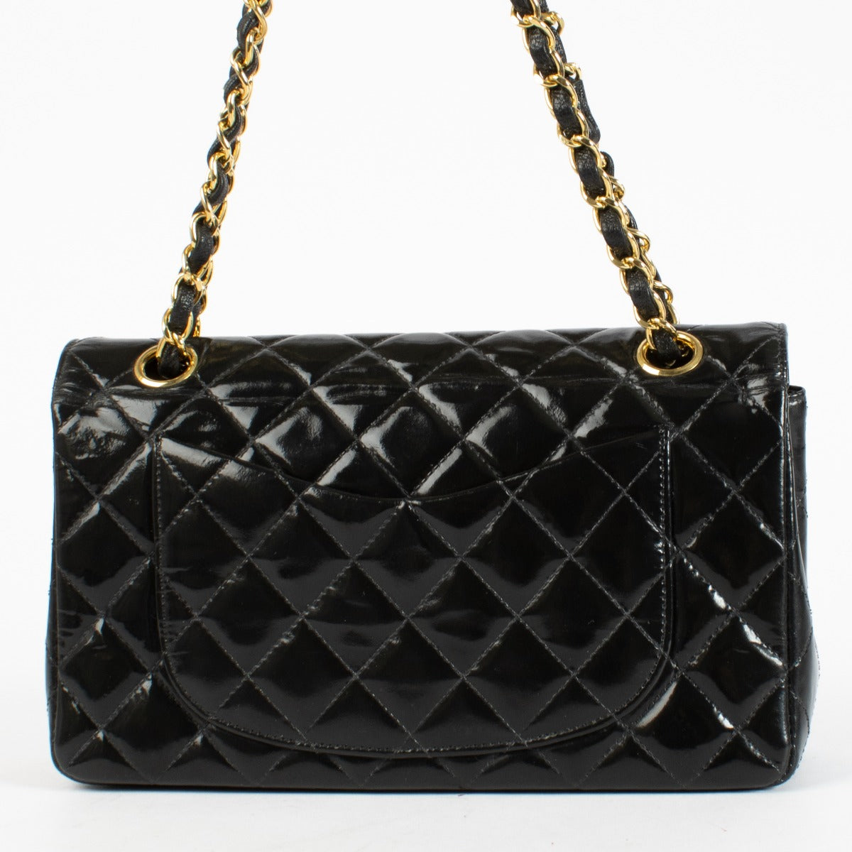Shop the Chanel Classic Double Flap Bag in black patent leather with gold hardware at Labellov.com