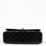 Shop the Chanel Classic Double Flap Bag in black patent leather with gold hardware at Labellov.com