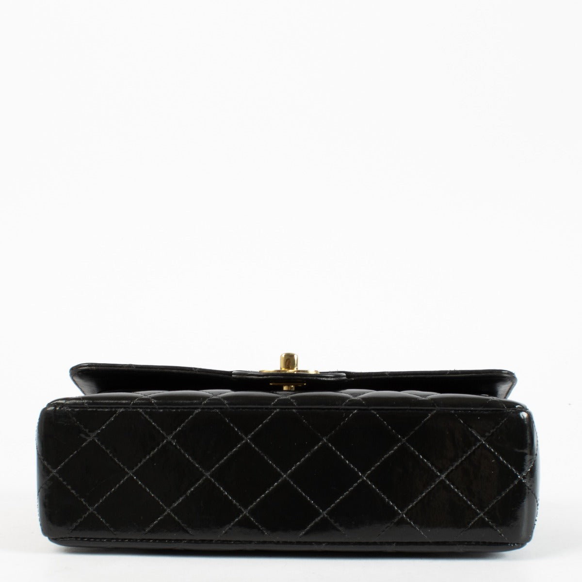 Shop the Chanel Classic Double Flap Bag in black patent leather with gold hardware at Labellov.com