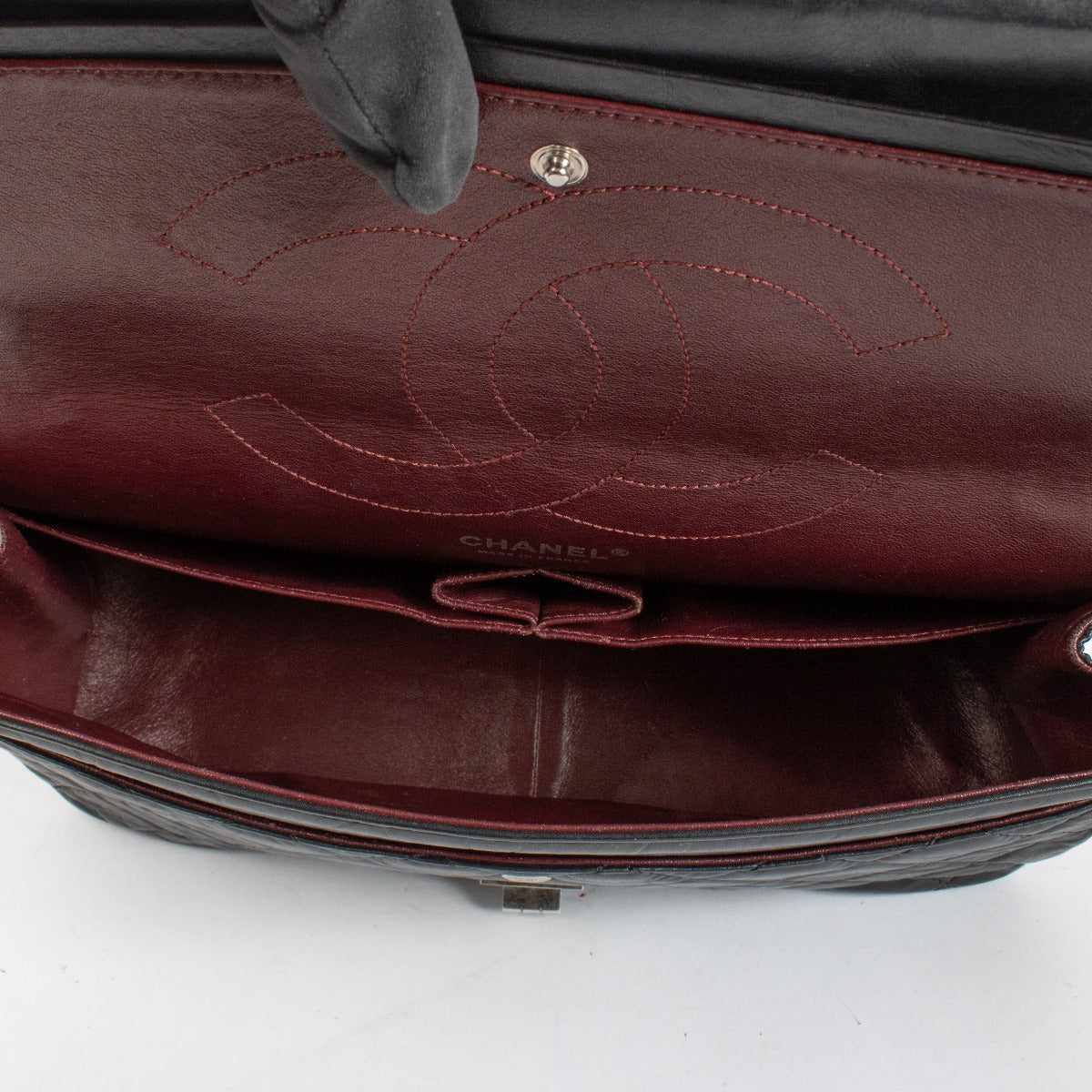 Authentic pre-loved Chanel Black Aged Calfskin Maxi 2.55 Bag on Labellov.com