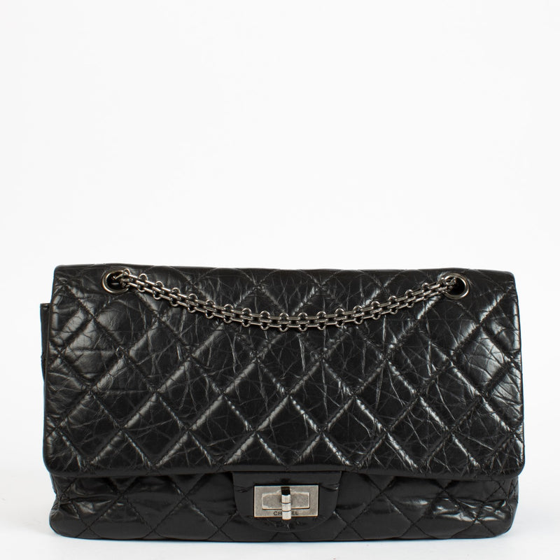 Authentic pre-loved Chanel Black Aged Calfskin Maxi 2.55 Bag on Labellov.com