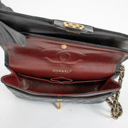 Authentic pre-loved Chanel Black Medium Classic 11.12 Flap Bag on Labellov.com