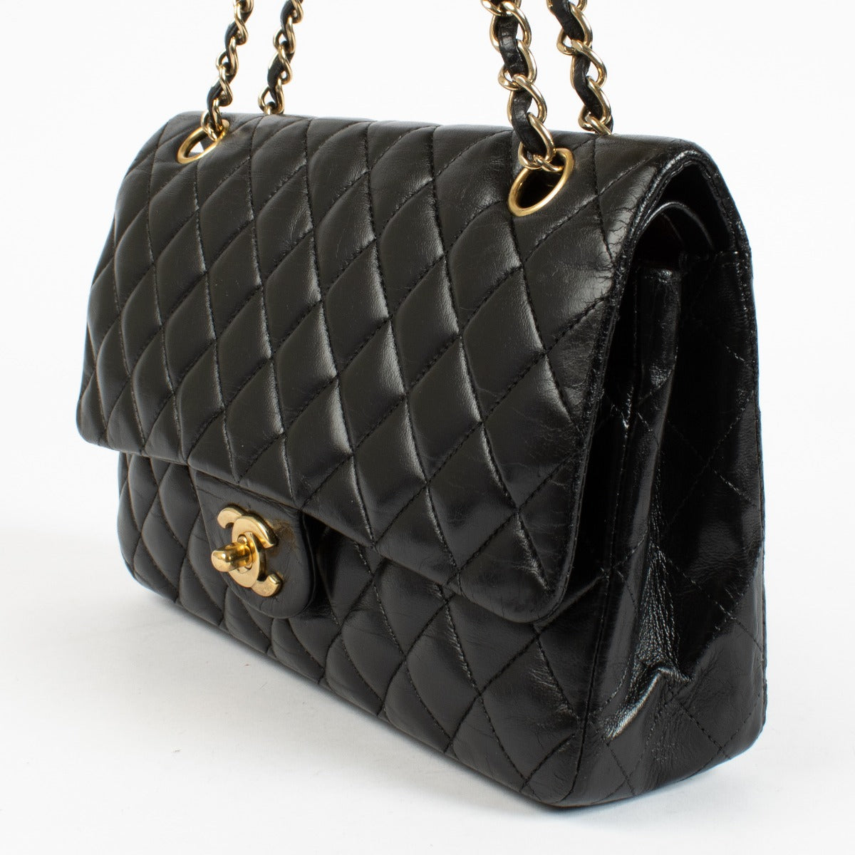 Authentic pre-loved Chanel Black Medium Classic 11.12 Flap Bag on Labellov.com