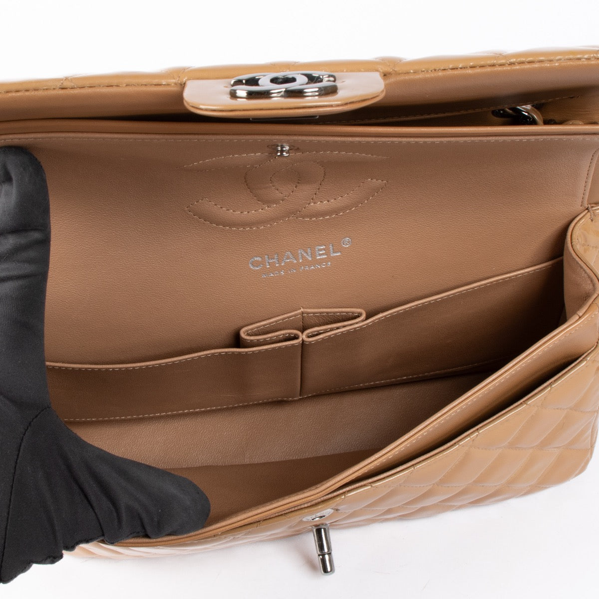 Shop safe online at Labellov in Antwerp, Brussels and Knokke this 100% authentic second hand Chanel Dark Beige Patent Leather Medium Classic 11.12 Handbag