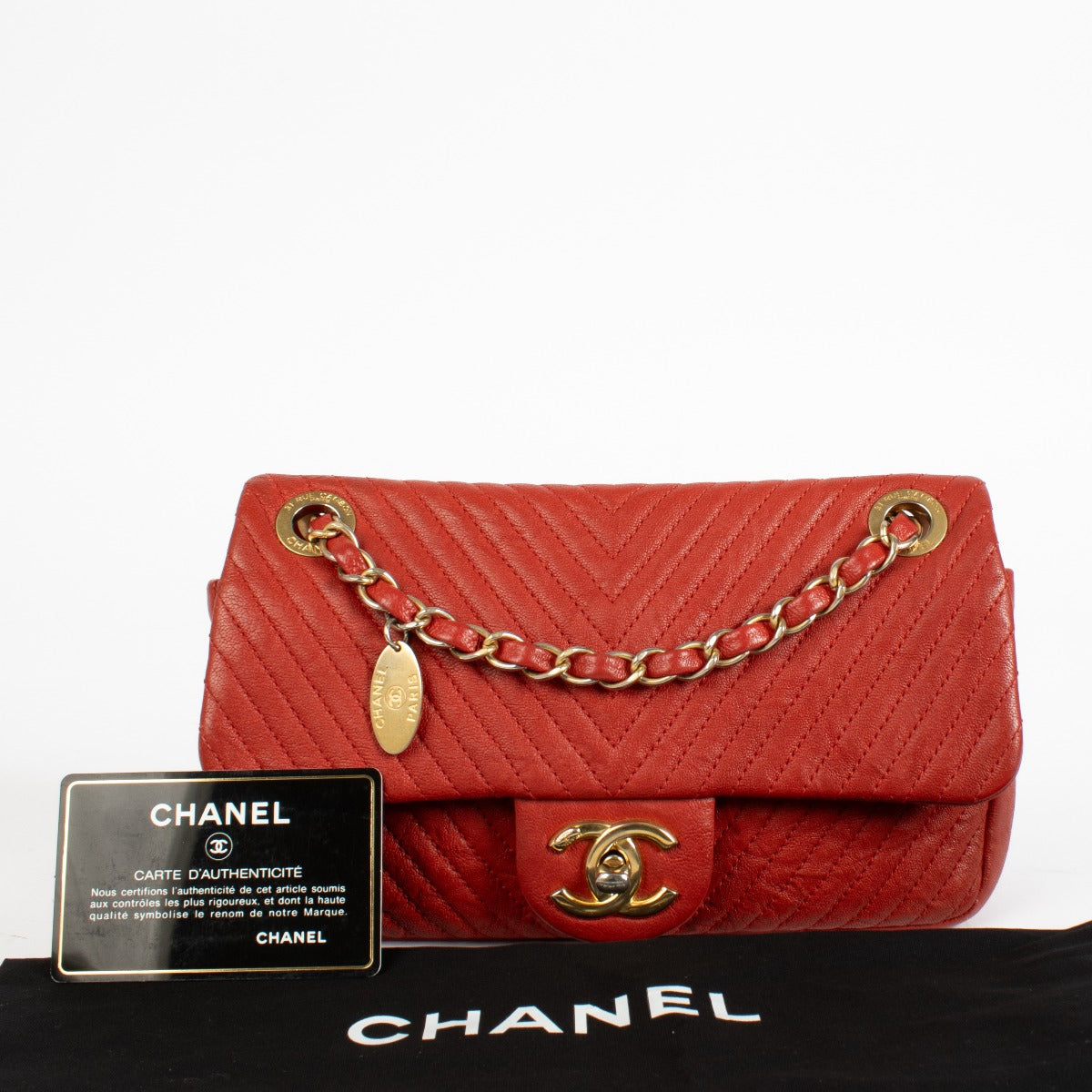 Authentic pre-loved Chanel Red Chevron Wrinkled Goatskin Medallion Mini Flap Bag on Labellov.com