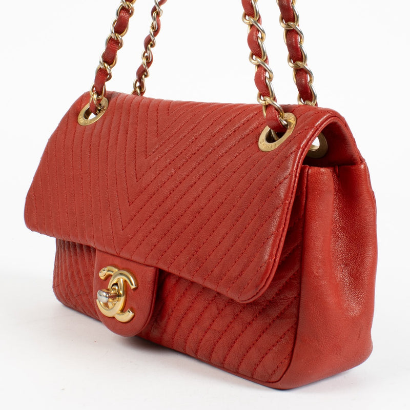 Authentic pre-loved Chanel Red Chevron Wrinkled Goatskin Medallion Mini Flap Bag on Labellov.com