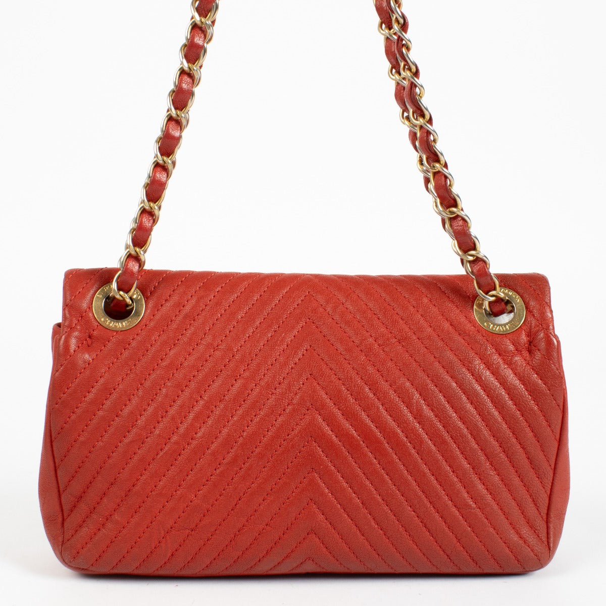 Authentic pre-loved Chanel Red Chevron Wrinkled Goatskin Medallion Mini Flap Bag on Labellov.com
