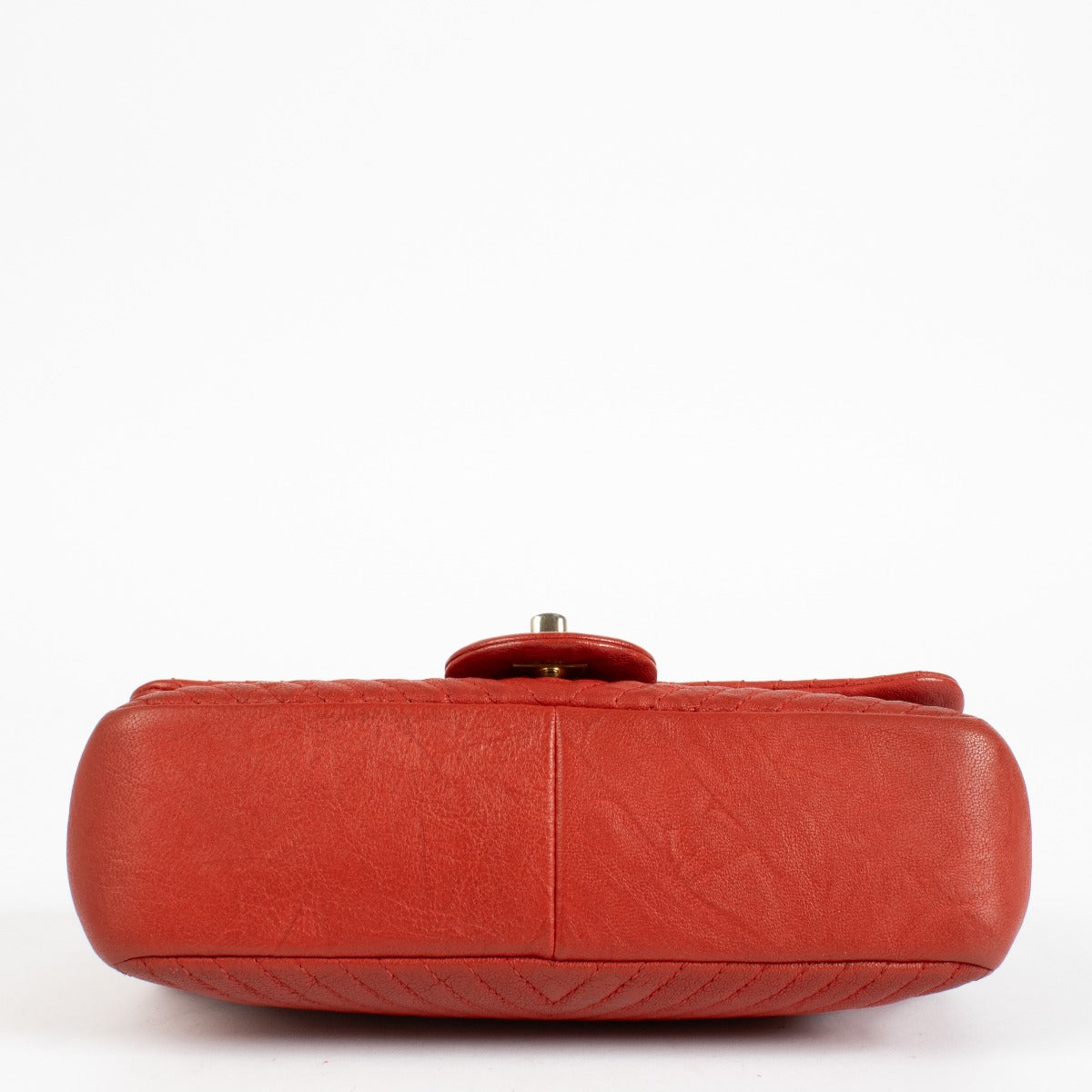 Authentic pre-loved Chanel Red Chevron Wrinkled Goatskin Medallion Mini Flap Bag on Labellov.com