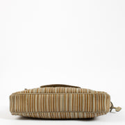 Delvaux vintage beige crossbody styled with neutral-toned outfit for timeless luxury look.