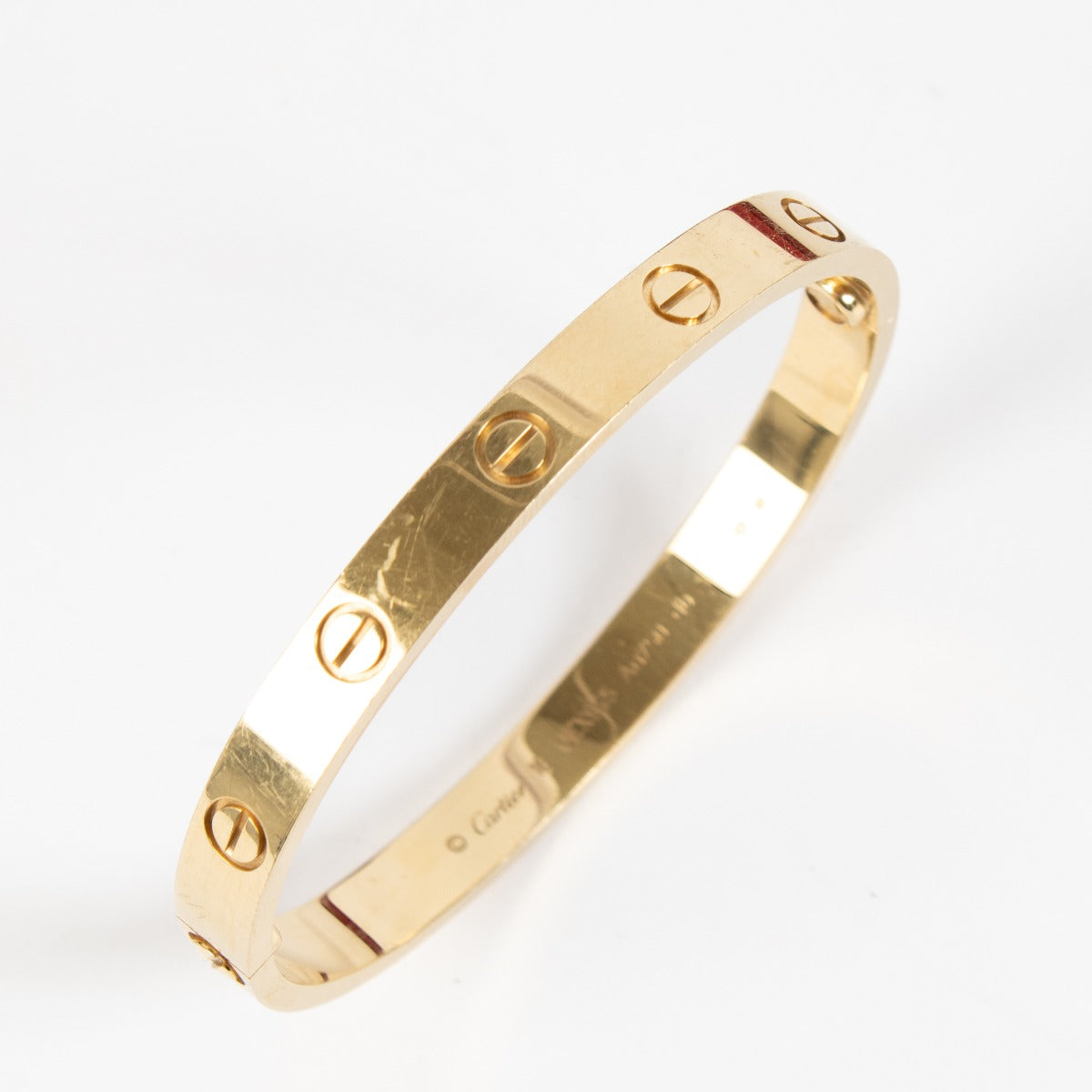 Preloved yellow gold Cartier love bracelet in size 16 on Labellov.com