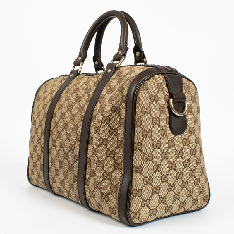 Gucci GG Supreme canvas Boston bag with brown leather trim at Labellov.com.