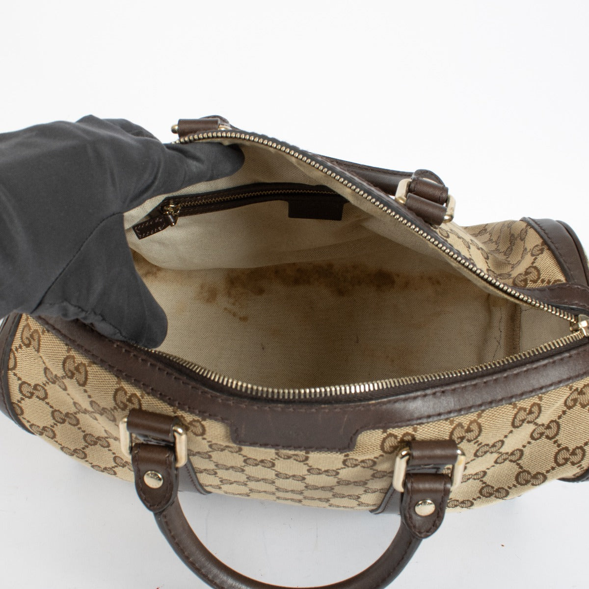 Gucci GG Supreme canvas Boston bag with brown leather trim at Labellov.com.