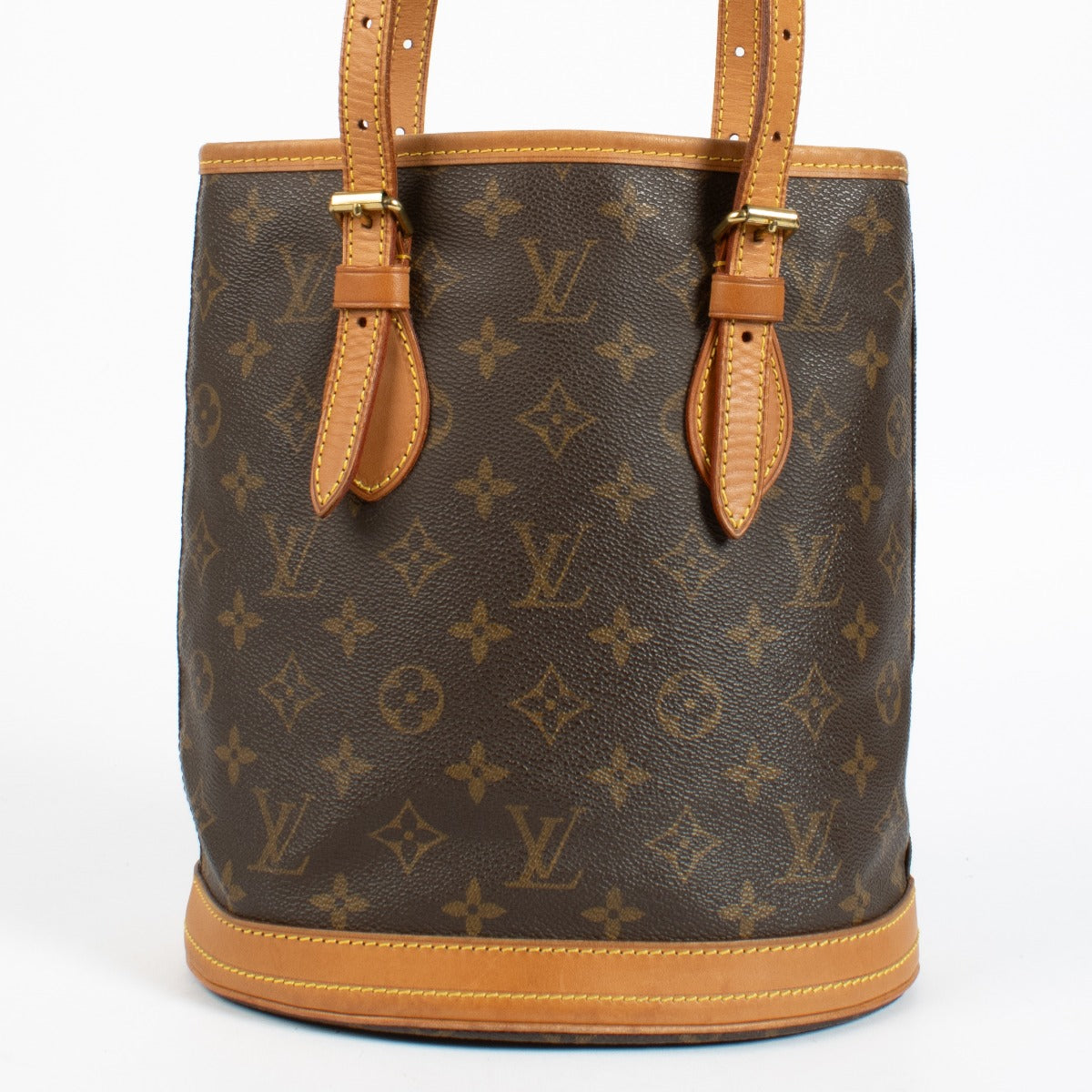 Authentic Louis Vuitton Petit Bucket bag in Monogram canvas with vachetta leather trim at Labellov.com