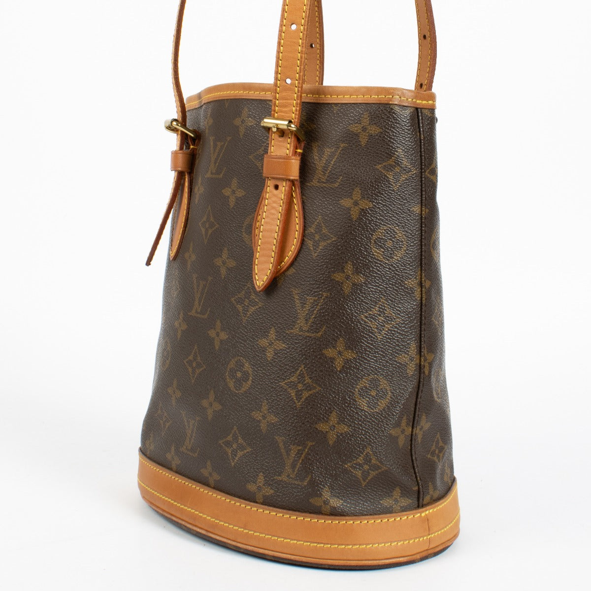 Authentic Louis Vuitton Petit Bucket bag in Monogram canvas with vachetta leather trim at Labellov.com