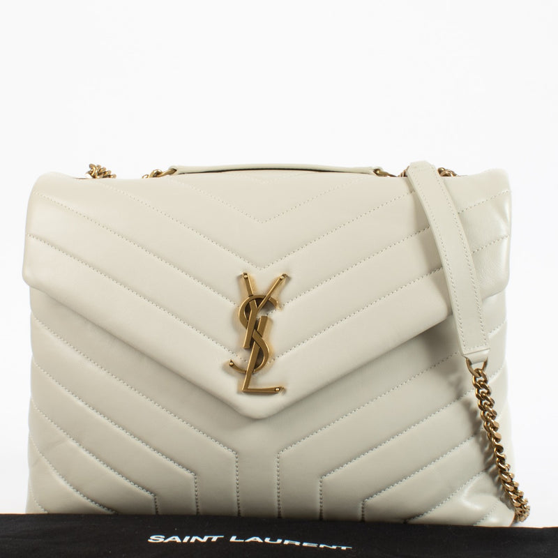 Shop safe online at Labellov in Antwerp, Brussels and Knokke this 100% authentic second hand Saint Laurent Cream Medium LouLou. Veilig online tweedehands authentieke Saint Laurent Cream Medium LouLou handtas kopen bij Labellov.