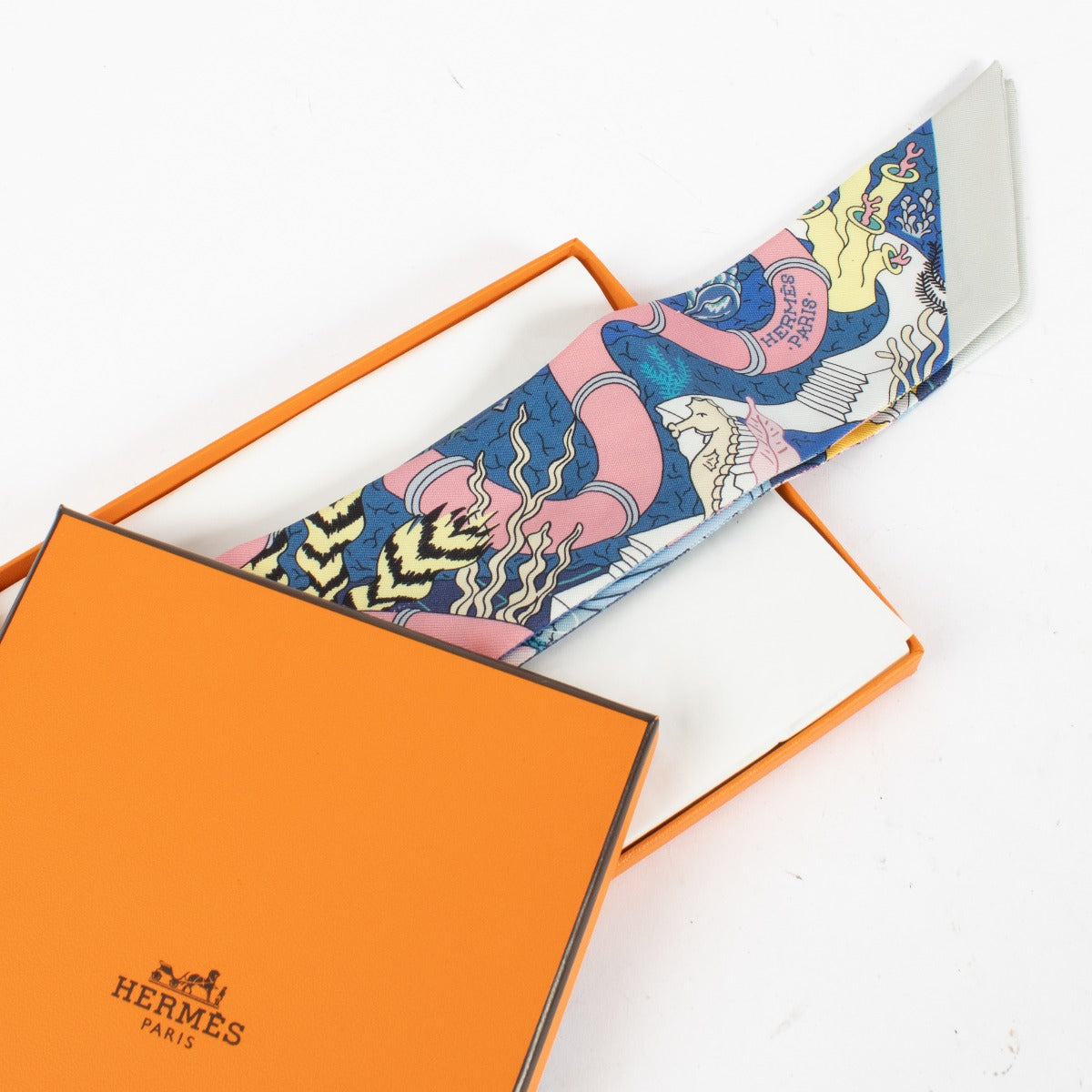 Hermès Blue Splash Park Twilly Scarf - for the best price at Labellov secondhand luxury in Antwerp and Knokke.